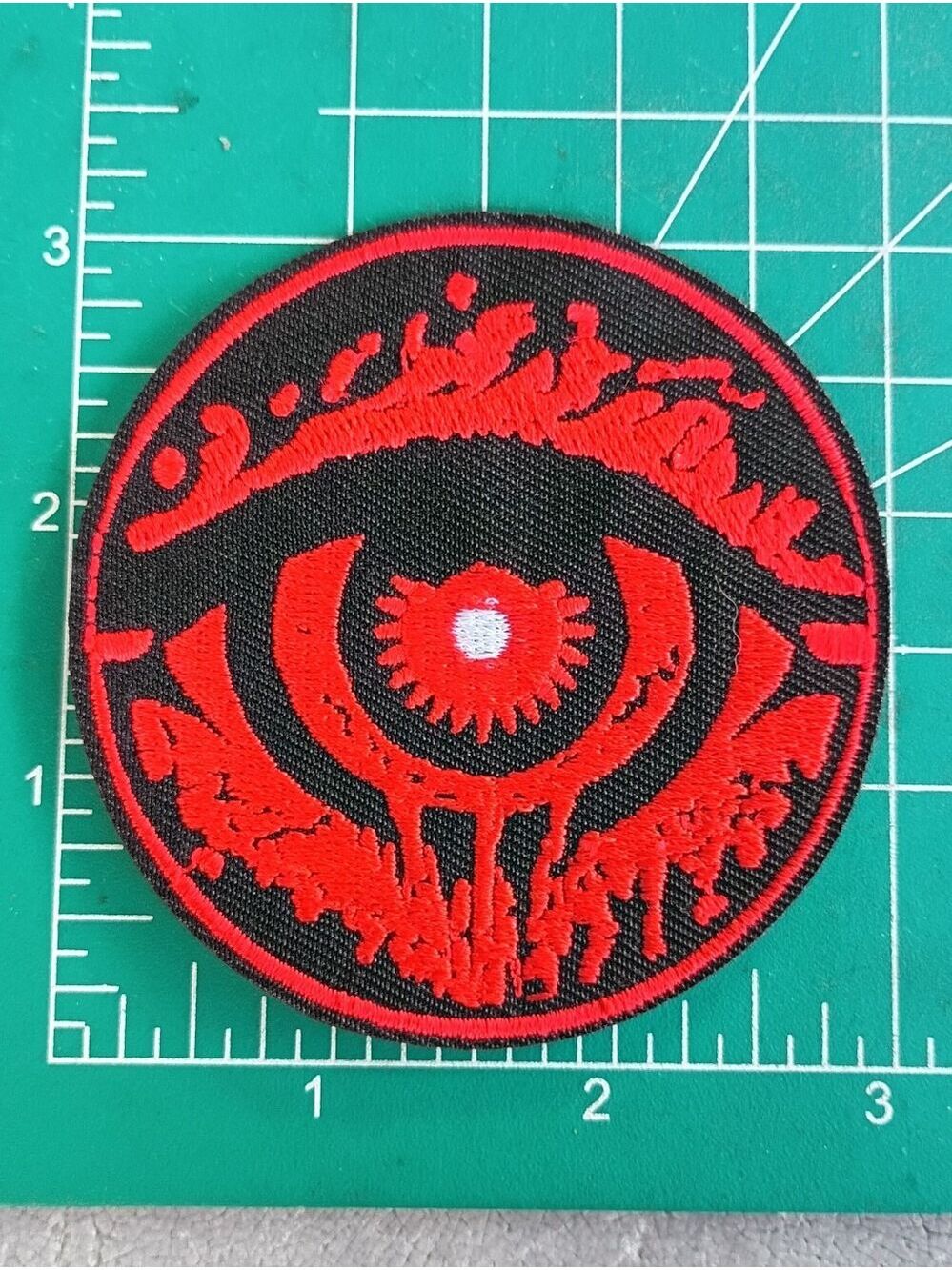 Cool Red And Back Eye Round Grunge Iron On Patch